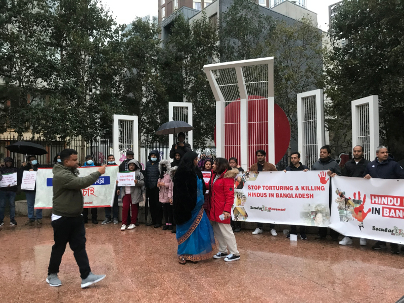 A man taking a photo of the protest